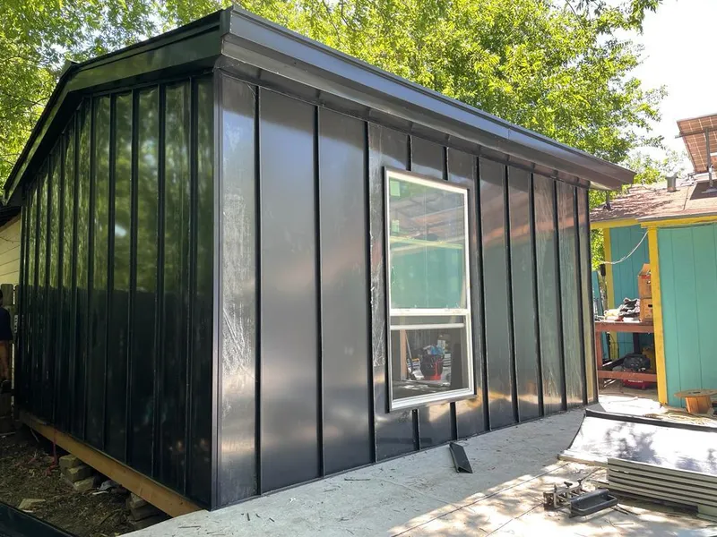 Black standing seam metal wall panels for Metal Roof Installation in Otis Orchards-East Farms